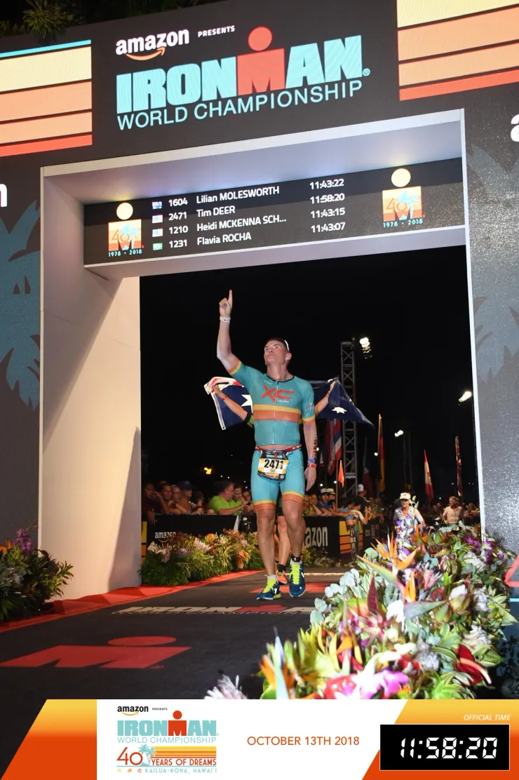 Dr. Timothy Deer crossing the finish line at the IRONMAN World Championship in Kona