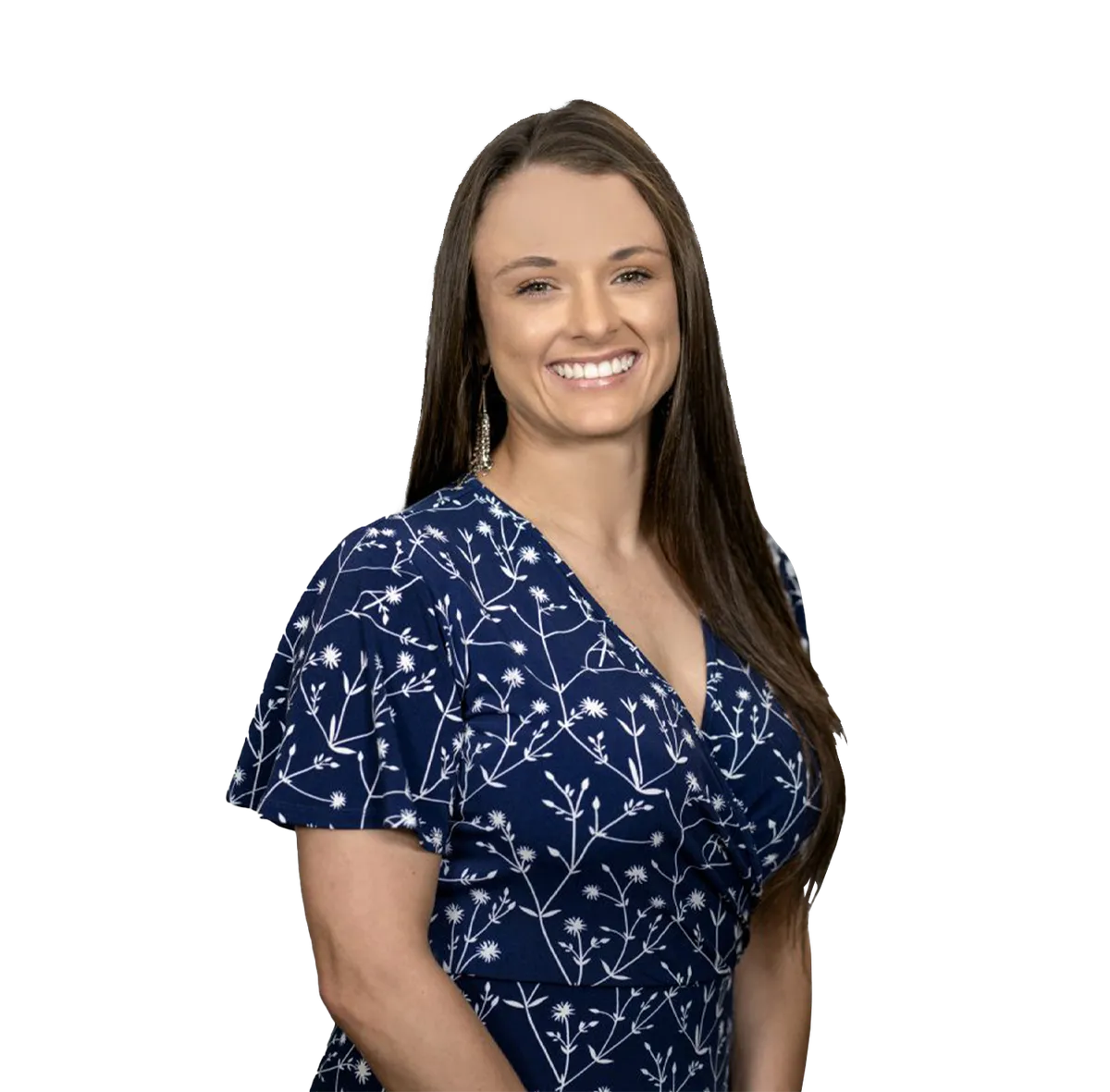 Portrait of Physician Assistant Danielle Molina wearing a blue floral-patterned dress, smiling