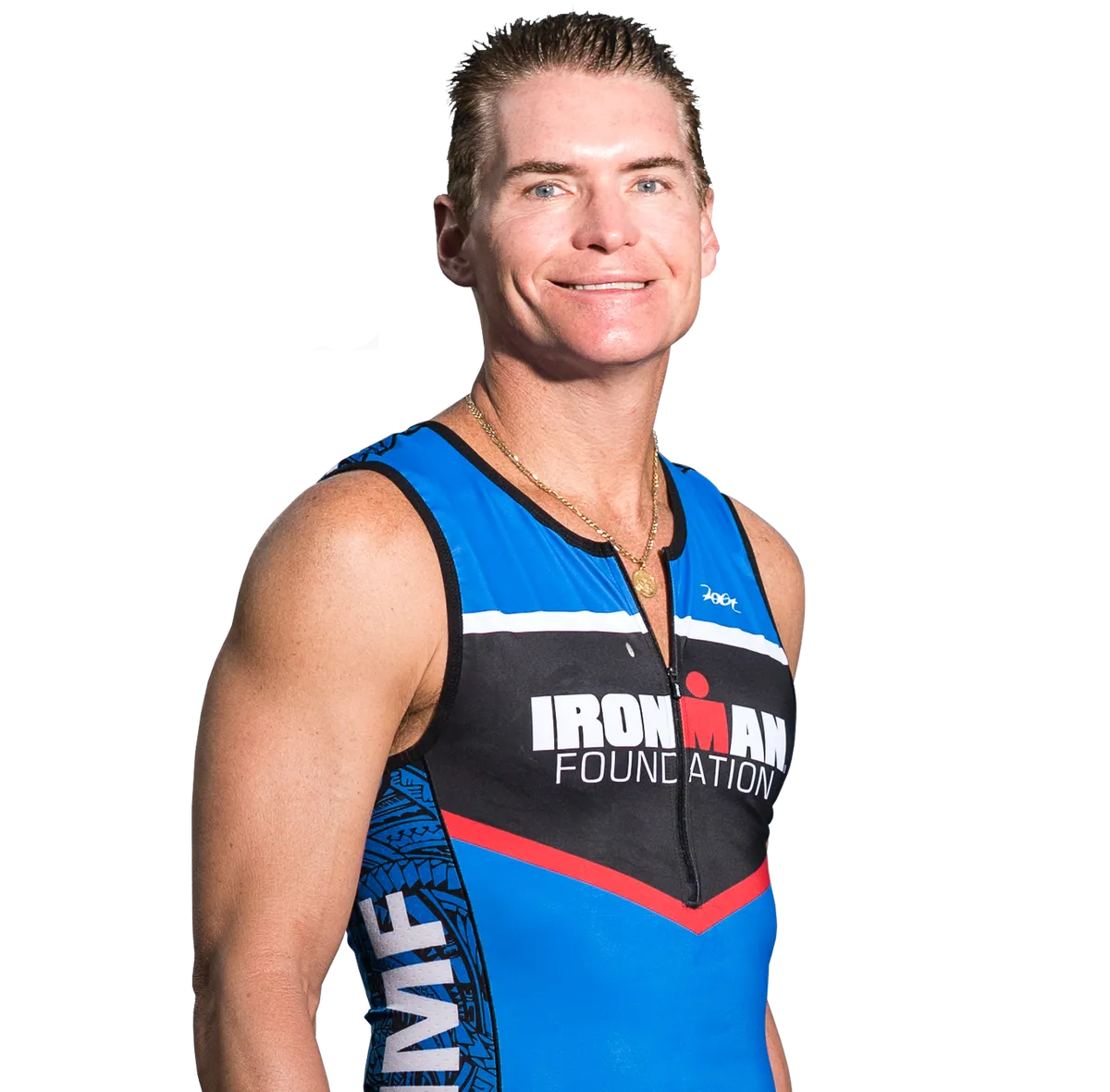 Portrait of Dr. Timothy Deer wearing a blue and black triathlon suit with ‘IRONMAN Foundation’ written on it, smiling