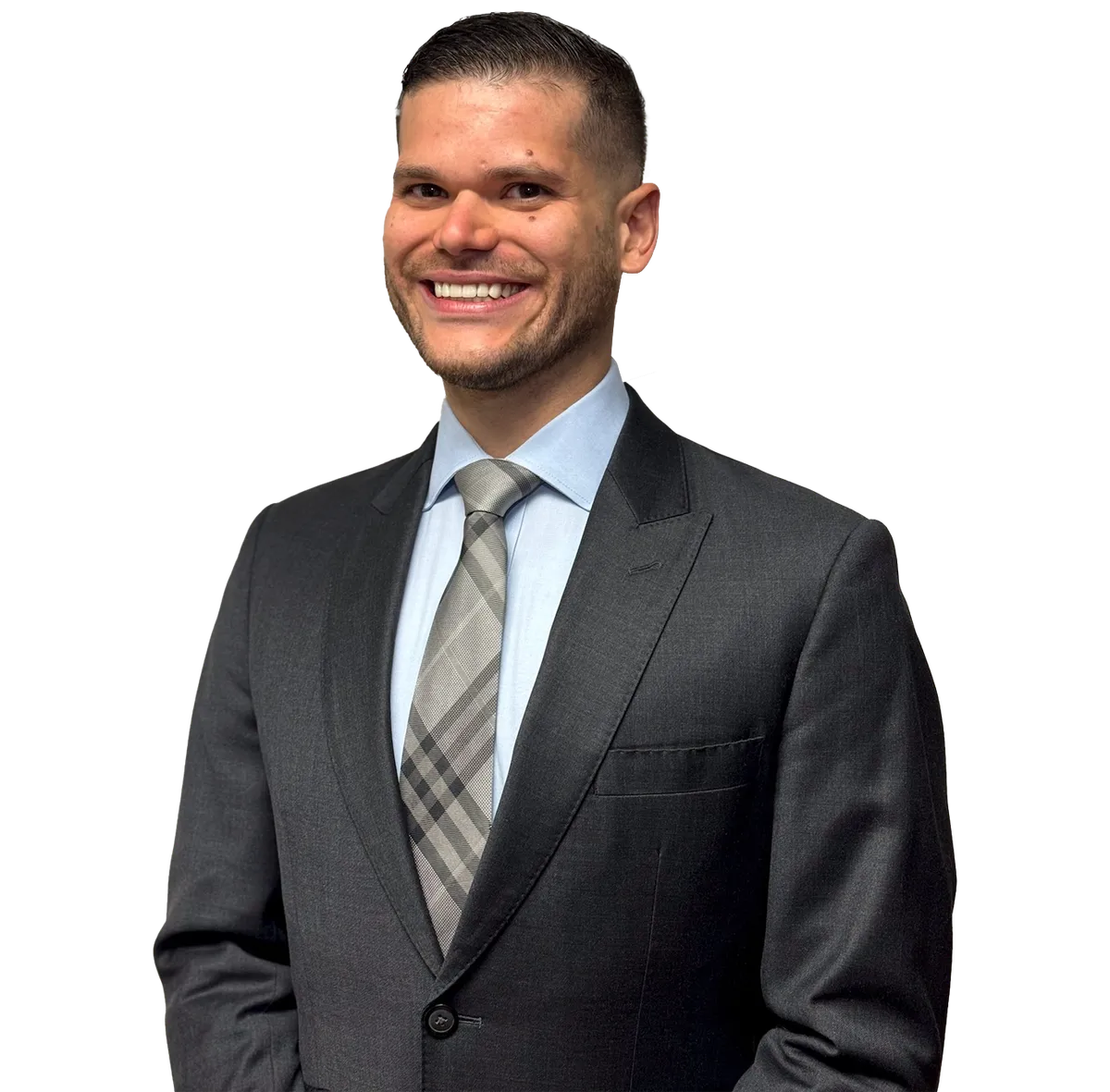 Portrait of Dr. Lucas Bracero wearing a dark suit, light blue shirt, and patterned tie, smiling