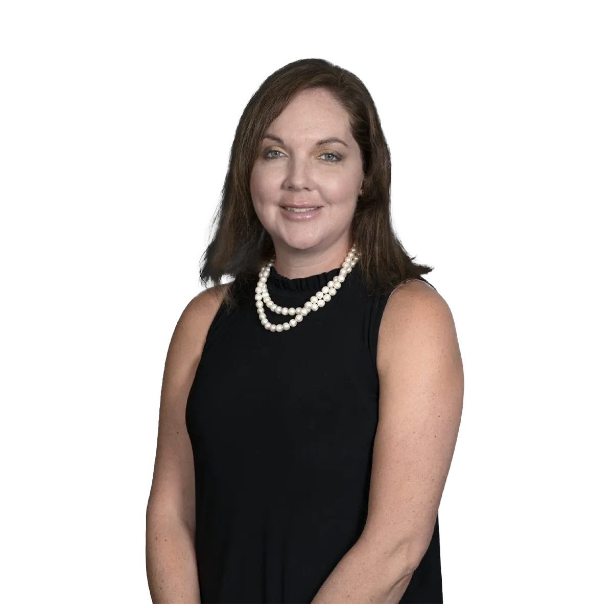 Portrait of Nurse Practitioner Tara Tackett wearing a sleeveless black top and a pearl necklace, smiling