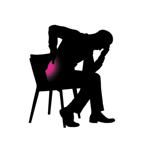 Person sitting with SI joint pain