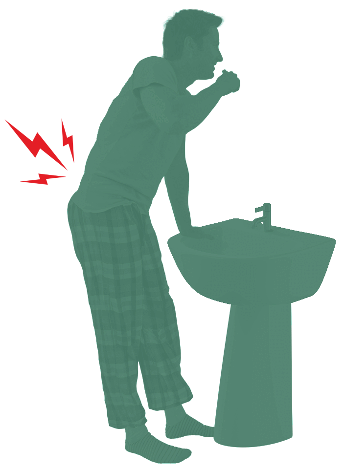 Person supporting himself at a sink due to low back pain